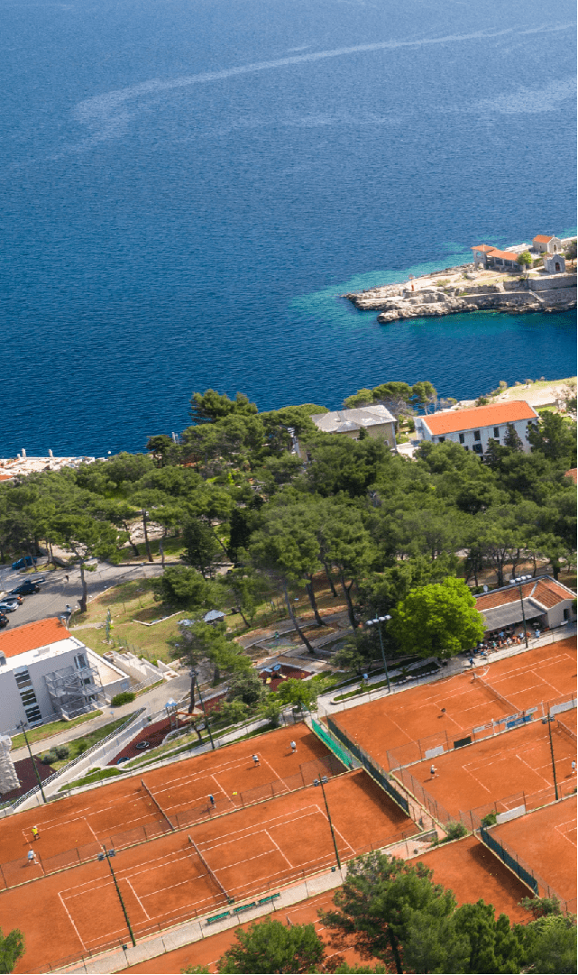 Vitality Hotel Punta and tennis courts at Ljubicic Tennis Academy where we see city of Veli Lošinj